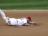 St. Louis Cardinals third baseman David Freese is unable to reach a single by San Francisco Giants' Buster Posey in the seventh inning during Game 3 of their MLB NLCS playoff baseball series in St. Louis