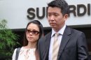 Howard Shaw (R), a member of a prominent Singaporean family, and his wife (L) leave the courthouse