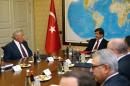 In this photo provided by the Turkish Prime Ministry Press Service, Turkish Prime Minister Ahmet Davutoglu, right, and U.S. Defense Secretary Chuck Hagel speak during a meeting in Ankara, Turkey, Monday, Sept. 8, 2014. Hagel is in Turkey for talks with Turkish leaders.(AP Photo/Hakan Goktepe, Turkish Prime Ministry)
