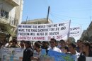 Demonstrators hold a banner during a protest against Syria's President Bashar al-Assad in Kafranbel