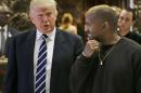 President-elect Donald Trump talks with Kanye West in the lobby of Trump Tower in New York, Tuesday, Dec. 13, 2016. (AP Photo/Seth Wenig)