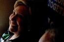 Democratic presidential candidate Hillary Clinton smiles as she speaks with Democratic vice presidential candidate, Sen. Tim Kaine, D-Va., on their campaign bus after visiting Imani Temple Ministries in Cleveland, Sunday, July 31, 2016. Clinton and Kaine are on a three day bus tour through the rust belt. (AP Photo/Andrew Harnik)