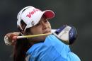 Pornanong Phatlum of Thailand tees off on the 18th hole during the third round of the LPGA Malaysia golf tournament at Kuala Lumpur Golf and Country Club in Kuala Lumpur, Malaysia, Saturday, Oct. 11, 2014. (AP Photo/Lai Seng Sin)