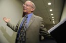 DeFazio throws up his hands as he talks to reporters after a Democratic caucus meeting with about debt relief legislation in Washington