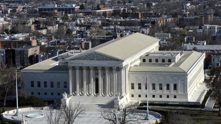  In this Dec. 19, 2013 file photo, a view of the Supreme Court can be seen from the view from near the top of the Capitol Dome on Capitol Hill in Washington. The Supreme Court hears arguments Monday in a clash between President Obama and Senate Republicans over the power granted the president in the Constitution to make temporary appointments to fill high-level positions. (AP Photo/Susan Walsh)