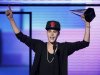 Justin Bieber accepts the award for favorite pop rock album at the 40th American Music Awards in Los Angeles