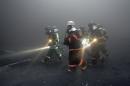 South Korean firefighters in Icheon, 80 kilometers (50 miles) south of Seoul, on January 7, 2008