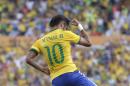 Brazil's Neymar celebrates after scoring against Panama during a friendly soccer match at the Serra Dourada stadium in Goiania, Brazil, Tuesday, June 3, 2014. (AP Photo/Andre Penner)