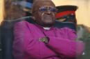 FILE - In this Dec. 10, 2013 photo, Retired Anglican Archbishop Desmond Tutu waits to speak during the memorial service for former South African president Nelson Mandela at the FNB Stadium in Soweto near Johannesburg. Archbishop Emeritus Desmond Tutu confirmed that he would not attend the funeral of Nelson Mandela after receiving no indication that his name was on a guest or accreditation list. (AP Photo/Matt Dunham)