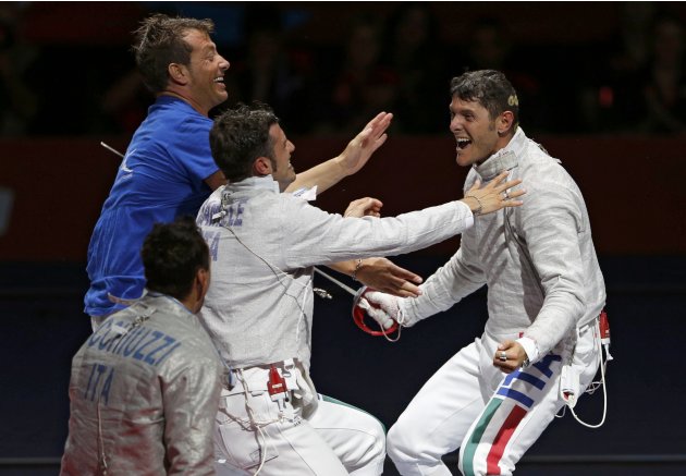 Italy's Aldo Montano celebrates their victory with team mates at the end of the men's sabre team bronze medal fencing competition against Russia at the London 2012 Olympic Games