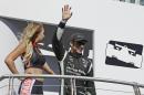 Simon Pagenaud, of France, waves during introductions before the start of the IndyCar auto race Sunday, Sept. 18, 2016, in Sonoma, Calif. (AP Photo/Eric Risberg)