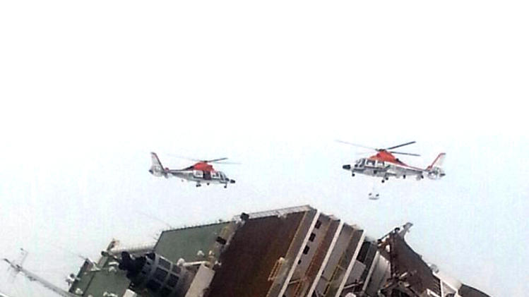 South Korean rescue helicopters fly over a South Korean passenger ship, trying to rescue passengers from the ship in water off the southern coast in South Korea, Wednesday, April 16, 2014. The South Korean passenger ship carrying more than 470 people, including many high school students, is sinking off the country&#39;s southern coast Wednesday after sending a distress call, officials said. There are no immediate reports of causalities. (AP Photo/Yonhap) KOREA OUT