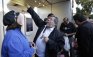 Apple co-founder Steve Wozniak points the way into an Apple store to buy a new Apple iPhone 4S in Los Gatos, Calif., Friday, Oct. 14, 2011. Wozniak waited 20 hours in line to be the first Apple customer at the Los Gatos Apple store to buy the new iPhone. (AP Photo/Paul Sakuma)