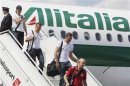 Italy's national soccer players Montolivo Giaccherini and Sirigu disembark from the team plane on arrival at the airport in Kiev