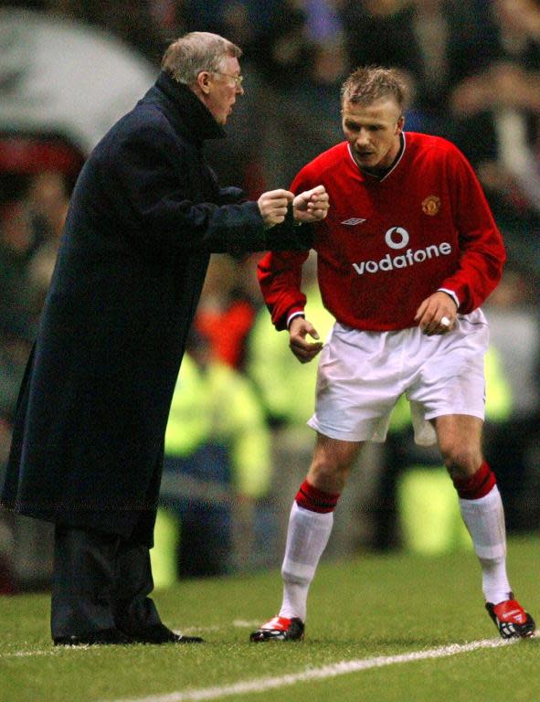 Manchester United's manager Sir Alex Ferguson (L) gives instructions to David Beckham during a Champions League match at Old Trafford in Manchester, on February 26, 2002