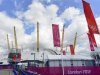 Olympics banners and flags are seen beside the North Greenwich Arena at Greenwich in London