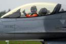 A Taiwanese pilot gives a thumbs up from the cockpit of a US-made F-16 fighter at the eastern Hualien air force base on January 23, 2013