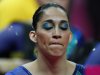 Brazilian gymnast Daniele Matias Hypolito, wears eye makeup in the colors of the national flag, waits to perform during the artistic gymnastics women's qualifications at the 2012 Summer Olympics, Sunday, July 29, 2012, in London. (AP Photo/Matt Dunham)