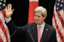 U.S. Secretary of State John Kerry waves after his lecture to students at Tokyo Institute of Technology in Tokyo Monday, April 15, 2013. Kerry is here as part of Asian tour amid a tense situation over a possible missile launch by North Korea. (AP Photo/Junji Kurokawa, Pool)