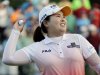 Inbee Park throws the ball up into the stands after winning a sudden death play during the LPGA Championship golf tournament at Locust Hill Country Club in Pittsford, N.Y. , on Sunday June 9, 2013 (AP Photo/Gary Wiepert)