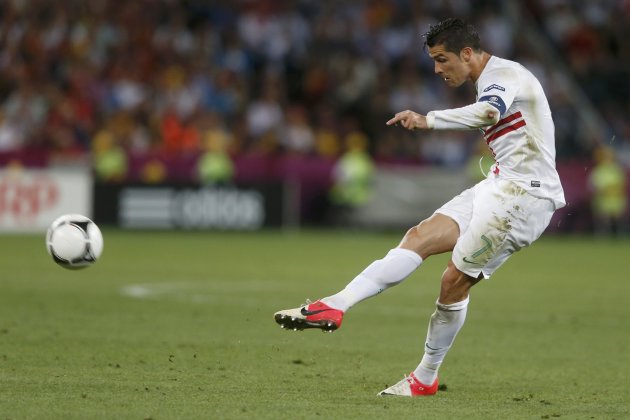 Portugal's Cristiano Ronaldo shoots a free kick during their Euro 2012 semi-final soccer match against Spain at the Donbass Arena in Donetsk