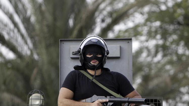 A riot police maintains order on al-Azhar university campus during student protests in Cairo