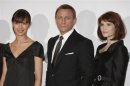 Actress Arterton who plays Agent Fields, actor Craig who plays "James Bond" and actress Kurylenko who plays "Camille" pose during a photocall at Pinewood Studios north of London
