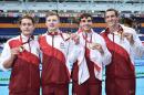Gold medallists England's Chris Walker-Hebborn, Adam Peaty, Adam Barrett and Adam Brown pose during the Men's 4 x 100m Medley Relay Final at the Tollcross International Swimming Centre during the Commonwealth Games in Glasgow on July 29, 2014
