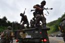 South Korean soldiers get off a truck during an anti-terror drill as part of an annual joint military drill called Ulchi Freedom, outside a tunnel in Seoul on August 18, 2014
