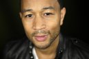 In this Thursday, Aug. 29, 2013 photo, singer John Legend poses for photos after an interview, in Los Angeles. Legend's fourth album, 