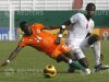 Ngossan Antoine Jean Ettien of Ivory Coast tackles Badian Vito of Senegal during the African Nations championship soccer tournament in Abidjan