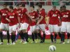 Players of Manchester United celebrate after their teammate Kagawa scoring a goal during a friendly soccer match against Shanghai Shenhua at the Shanghai Stadium in Shanghai