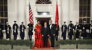 FILE - In this Jan. 19, 2011 file photo, U.S. President Barack Obama and first lady Michelle Obama pose with China's President Hu Jintao at the North Portico of the White House in Washington. In the simplistic narrative of U.S. presidential politics, China is a Hollywood villain, a monetary cheat that is stealing American jobs. But in the debate Tuesday night, Oct. 16, 2012 the one-dimensional caricature offered up by Obama and Republican challenger Mitt Romney obscures the crucial reality of U.S.-China relations: For all the talk about getting tough on Beijing, the U.S. and China are deeply entwined, defying easy solutions to the friction and troubles that beset their relations. (AP Photo/Pablo Martinez Monsivais, File)