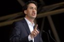 Britain's opposition Labour Party leader Ed Miliband, speaks to demonstrators in Hyde Park at the end of a protest march in central London
