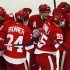 Detroit Red Wings players celebrate with teammate Niklas Kronwall after he scored the game winning goal against Edmonton Oilers goalie Nikolai Khabibulin during the third period of their NHL hockey game in Detroit