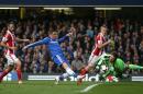Chelsea's Fernando Torres, center, has his shot on goal saved by Stoke City's Asmir Begovic, right, during their English Premier League soccer match between Chelsea and Stoke City at Stamford Bridge stadium in London, Saturday, April, 5, 2014. (AP Photo/Alastair Grant)