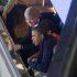 President Barack Obama sits with NCAA President Mark Emmert, top, as they attend the East Regional final of the NCAA men's college basketball tournament between Syracuse and Marquette, Saturday, March 30, 2013, in Washington. (AP Photo/Carolyn Kaster)