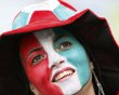An Italian fan cheers as she waits for the start of their Group C Euro 2012 soccer match against Spain in Gdansk