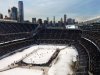Minnesota plays Wisconsin in the second period of a college hockey game in the OfficeMax Hockey City Classic at Chicago's Soldier Field, Sunday, Feb. 17, 2013. (AP Photo/Charles Rex Arbogast)