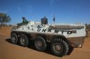 A member of the UN-African Union mission in Darfur sits on an armoured personnel carrier patrolling near the city of Nyala, January 12, 2015 in Sudan