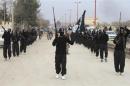 Fighters of al-Qaeda linked Islamic State of Iraq and the Levant parade at Syrian town of Tel Abyad