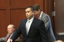 George Zimmerman, center, walks into court with attorney Mark O'Mara, right, Friday, Oct. 26, 2012 in Sanford, Fla. The prosecutor in the case of Zimmerman, the former neighborhood watch leader accused of shooting an unarmed teenager, called O'Mara's conduct "a slippery slope" in pleading with the judge Friday to impose a gag order on all attorneys. (AP Photo/Orlando Sentinel, George Skene, Pool)