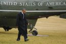 U.S. President Obama returns to the White House while raining in Washington