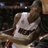 Miami Heat's Bosh collides with Chicago Bulls' Boozer in the first half of their NBA basketball game in Miami, Florida