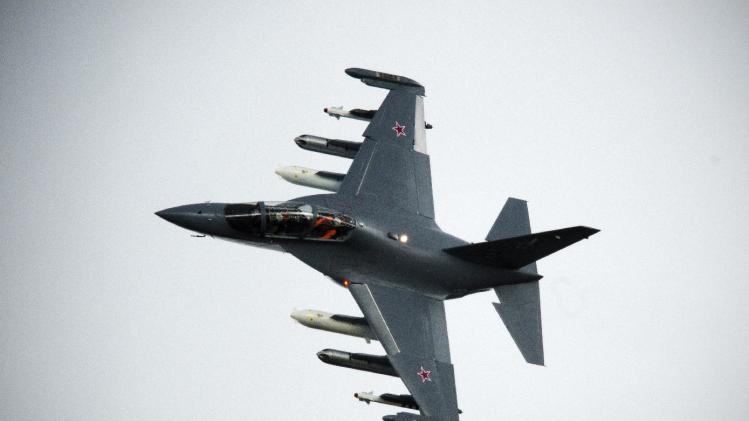 A Russian-made Yak130, a subsonic two-seat advanced light attack aircraft, manoeuvres during a flying display at the Farnborough International Airshow in Hampshire, southern England, on July 11, 2012