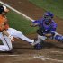 Orioles base runner Taylor Teagarden is tagged out by Toronto Blue Jays catcher J.P. Arencibia in the sixth inning in their second game of a double header