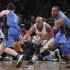 Brooklyn Nets forward Bogans cuts between Orlando Magic guard Redick and forward Davis to steal the ball in the fourth quarter of their NBA basketball game in New York