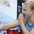 Lithuania's Ruta Meilutyte reacts after taking first place in heat 4 at the women's 100m breaststroke heats during the London 2012 Olympic Games at the Aquatics Centre