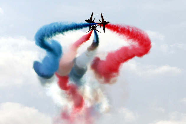 Britain's Royal Air Force Red Arrows display team perform over Chatsworth Country Fair in Derbyshire Friday Sept. 2, 2011. The Red Arrows gave their first public aerobatics display Friday since the de