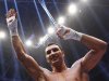 Klitschko of Ukraine celebrates after defeating Mormeck of France in their IBF/WBO, WBA and IBO world heavyweight championship title fight in Duesseldorf
